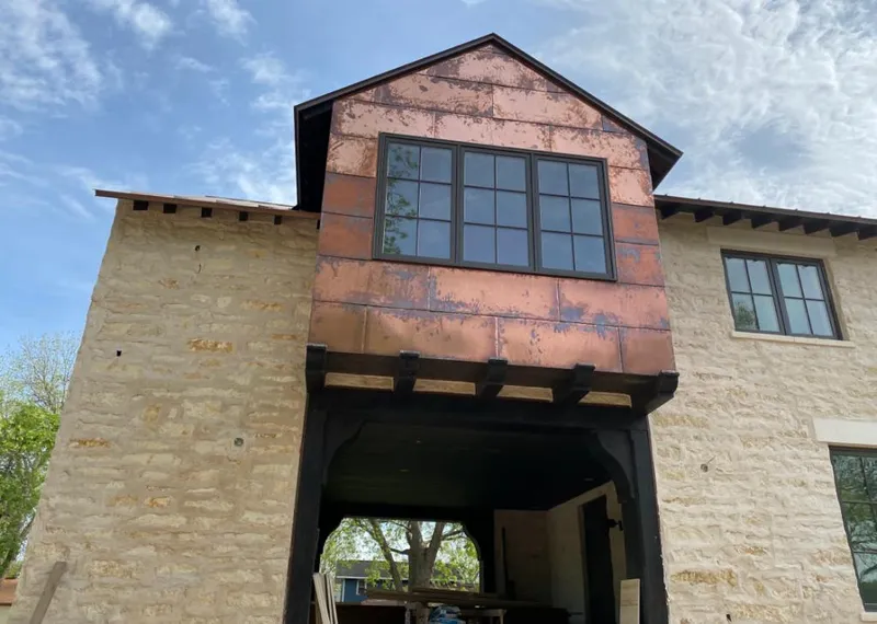 Copper metal panel facade on a stone building for Metal Roof Coating in Round Lake Park