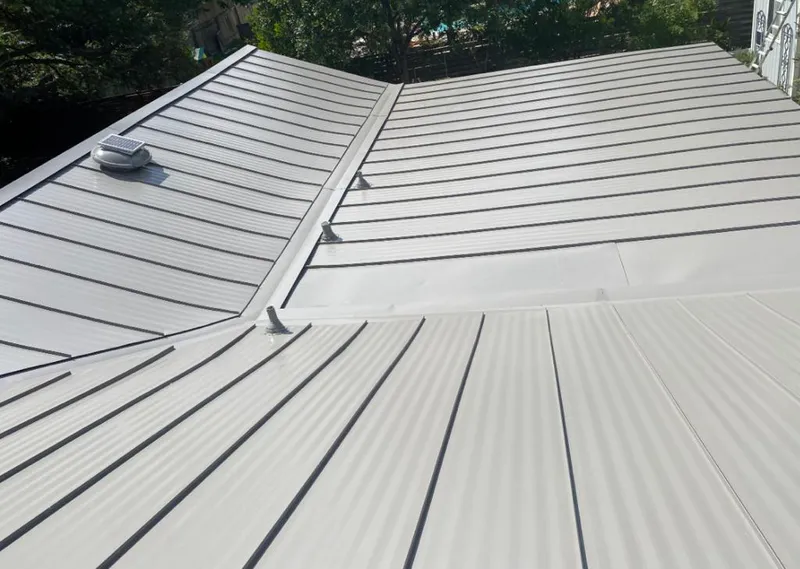 Solar attic fan installed on a metal roof for Roof Ventilation in Round Lake Park